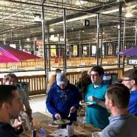 Group of people sharing a meal at an Alumni Social